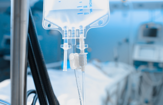 Intravenous drip on the background of patient under the heart monitoring. Source_istockphoto.com. Credit_sudok1